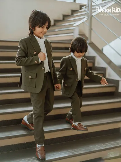 The bond between brothers is special, and we love creating outfits to match. Here, two brothers wear our custom-designed olive green shacket sets, featuring functional pockets and a comfortable fit, perfect for making memories together.