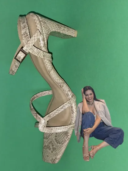 A creative shot for the footwear brand Pairie Tales. "Where fashion meets sole," featuring a pair of their stylish snake-print heels.