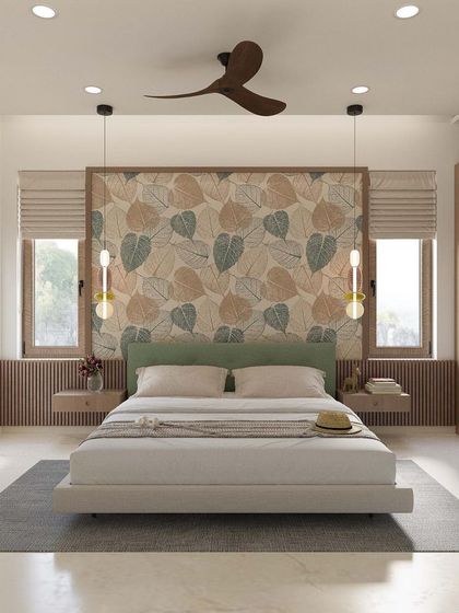 This bedroom design brings the outdoors in with a beautiful leaf-patterned wallpaper behind the bed. The light wood tones and simple, modern furniture create a fresh and serene environment, perfect for relaxation.