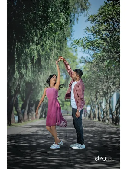 A spontaneous dance on a tree-lined road. This shot is pure joy and movement, capturing a moment of carefree happiness.