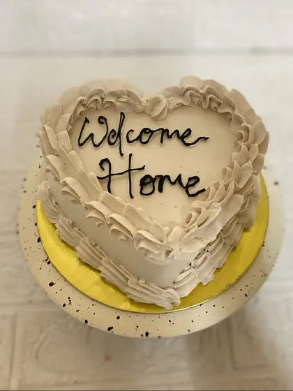 A piece of our heart, for you to celebrate. This heart-shaped Belgium chocolate cake with vintage ruffles is perfect for a "Welcome Home" celebration.