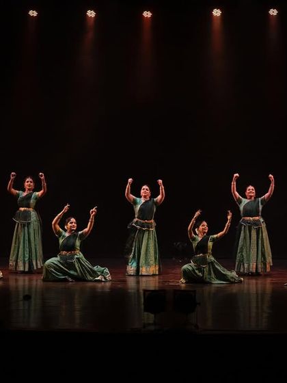 The finale of a powerful sequence in 'Ek Anant', with the full ensemble on stage. The energy of a live orchestra on the side elevates the performance to another level.