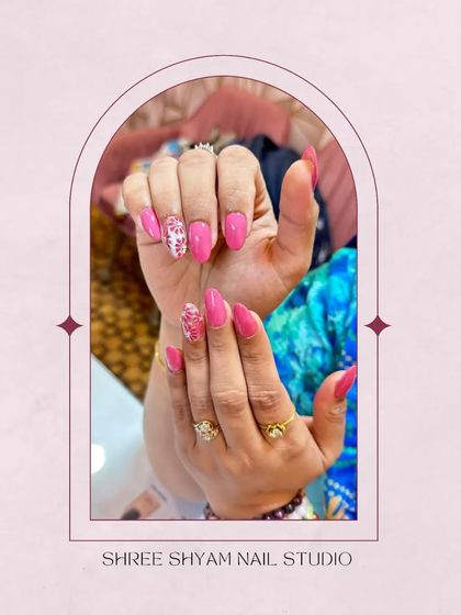 A beautifully framed shot of the pink cat-eye nail art, perfect for your next appointment.