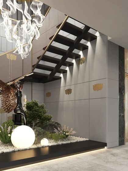 Another view of the brass-inlaid concrete panels along the staircase. The design adds a touch of sophistication and serves as an artistic element in this grand entryway.