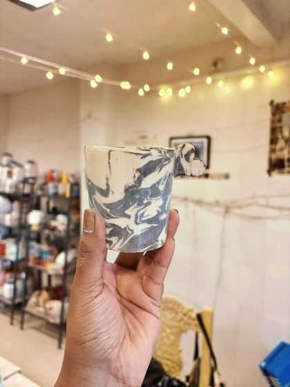 This marbled Nerikomi mug with a tiny, delicate handle was also part of a beginner's first set of creations. It’s a wonderful example of learning to combine different techniques.