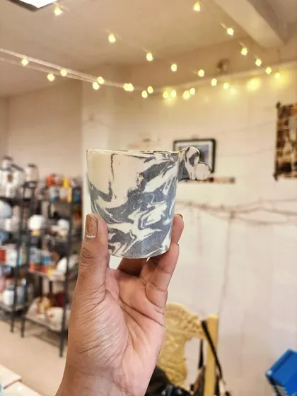 This set from a recent beginner's course graduate feels so playful and full of life. She experimented with marbled swirls, bold splatters, and soft greens, just trying things out and having fun with the clay. This is exactly what the journey is about.