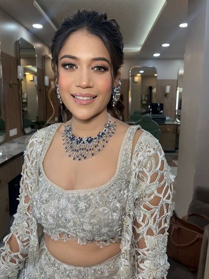 A beautiful soft glam look for a party or reception. The makeup is fresh and modern, with a focus on glowing skin.