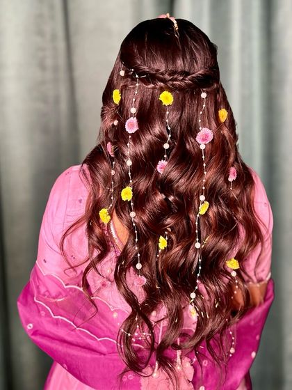 The full effect of the cascading flowers and pearls through the soft brown waves. A truly magical look for a special day.