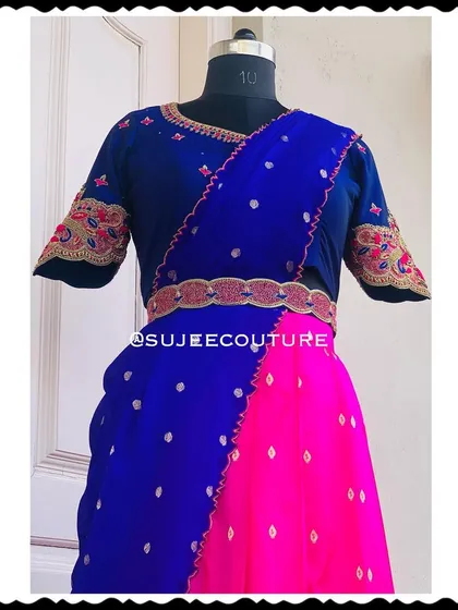 Another view of the blue and pink half saree, showcasing the beautiful drape of the dupatta and the intricate details of the custom blouse and belt.
