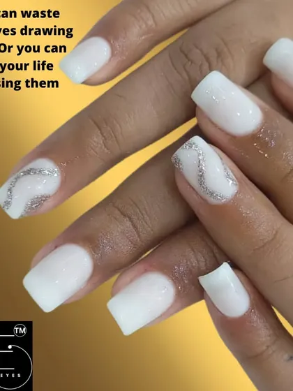A clean and bright white manicure on square nails. The simple silver glitter swirl on the accent nails adds just the right amount of sparkle.