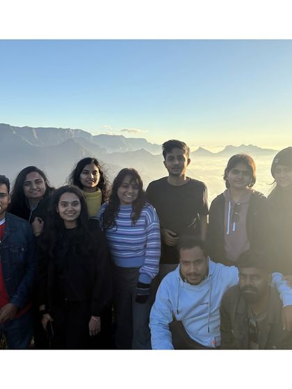 The group together above the clouds at Kolukkumalai, after witnessing the spectacular sunrise.