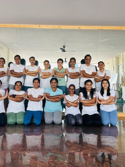 The full group of participants, united in their achievement. This is what our yoga community is all about.