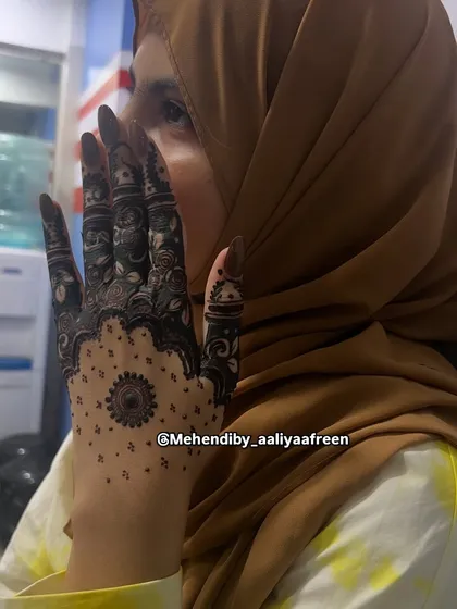Another shot of the striking black henna design, perfect for making a statement.