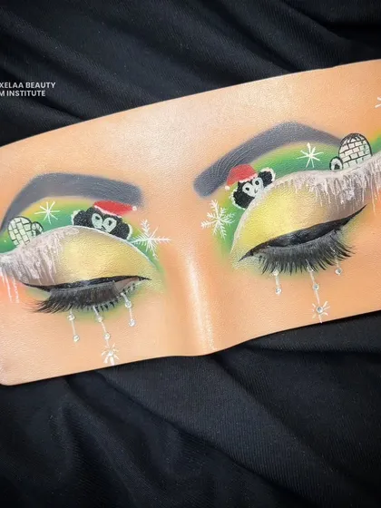 Inspired by the magic of the holiday season. This festive eye look on a practice board features cute penguins and igloos for a touch of winter wonder.