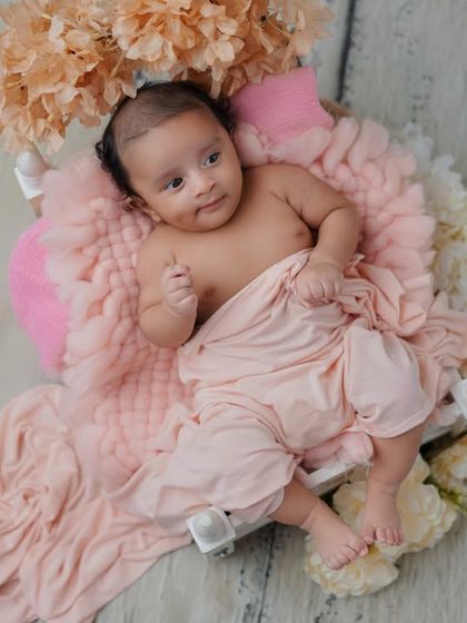 A curious glance. This little one is awake and taking in the world, and I love capturing that sense of wonder in their eyes.