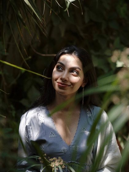 A hopeful, upward glance captured in a beautiful play of light and shadow. This image is about dreaming and introspection, using a simple expression to convey a deeper feeling.