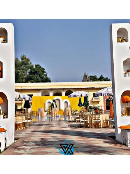 A Haldi ceremony is all about vibrant joy. We built these grand entrance pillars with traditional arched niches, filled with marigolds and brass decor, to welcome guests into a sun-drenched celebration full of color and energy.