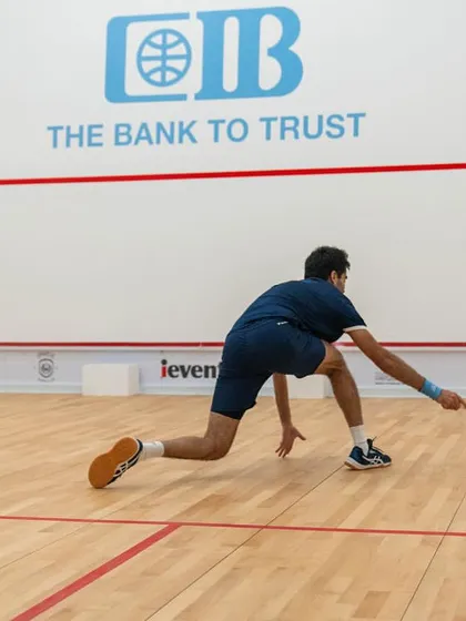 Ramit Tandon lunging for a difficult shot, showcasing the athleticism and determination we instill in our professional players.