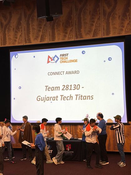 The moment of victory for Team Gujarat Tech Titans. The screen announces their win of the Connect Award, the third highest honor at the FTC Asia Pacific Open Championship, recognizing their work in making STEM accessible.