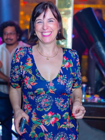 A guest with a big smile, enjoying the party.