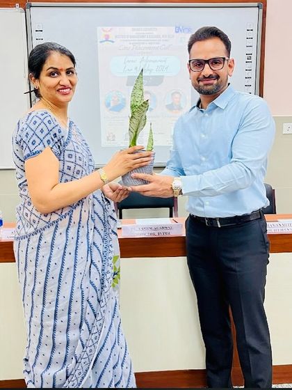 Receiving a token of appreciation at a law school event. Engaging with students is an essential part of my commitment to mentorship and legal education.