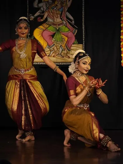 A moment of storytelling from a duet performance. Choreographing and performing pieces that explore the relationship between divine figures like Shiva and Shakti or Radha and Krishna allows for deep emotional expression and connection.