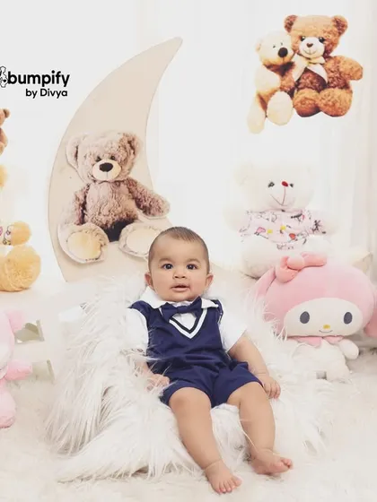 A full view of the 'Teddy Bear World' setup, showing the moon prop and all the cute teddy bears that create this magical environment for a baby photoshoot.