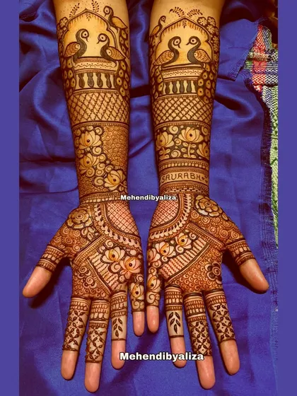The final look of the engagement henna with peacocks. The design is both traditional and elegant, perfect for the special occasion.