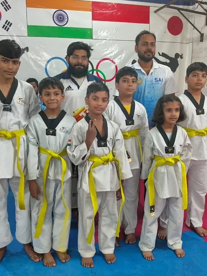 Our newest yellow belts, excited to begin the next phase of their Taekwondo journey.