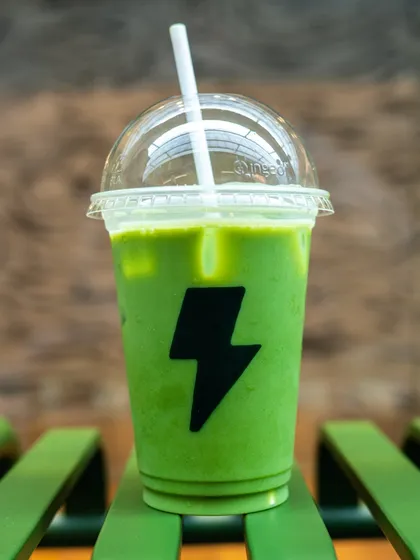 A vibrant iced matcha latte from Jenki Matcha. The bright green color and bold branding make for a punchy and modern product shot.