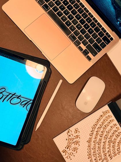 Balancing being an artist with the dream of becoming a tattoo artist. Here's a look at my desk, where I'm designing a custom calligraphy tattoo on my iPad.