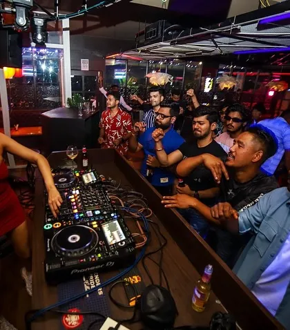 A view from behind the decks at The Tribe, with the crowd fully engaged and dancing. I love being close to the energy, feeding off it and giving it right back.