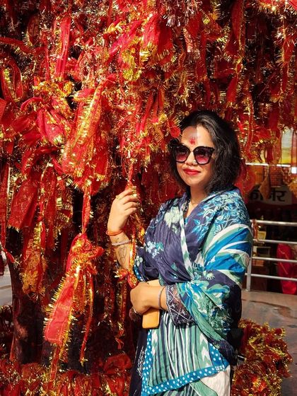 A beautiful blue printed dupatta draped gracefully for a temple visit. This shows how a single piece can define a spiritual and stylish look.