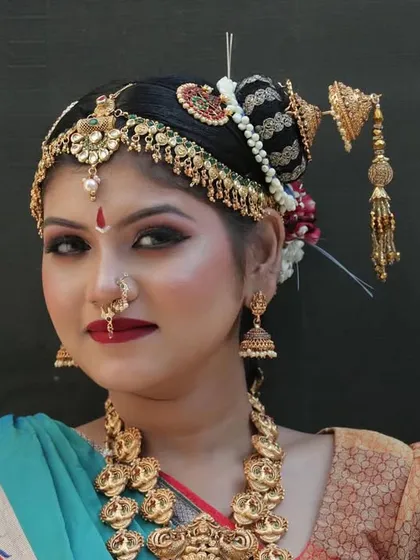 A confident, forward-facing portrait of our South Indian bride, showcasing a look my students are trained to perfect.