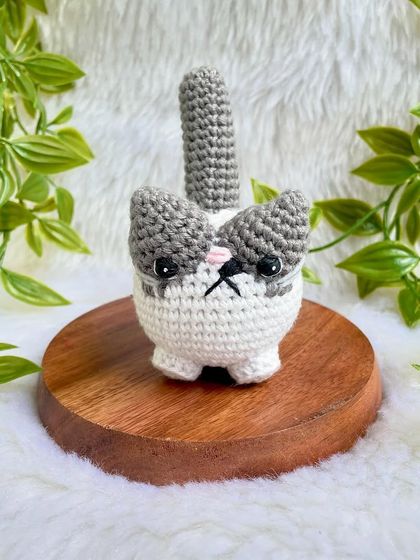 A grumpy but cute little cat plushie. I love his expressive face! This was a custom order to replicate a customer's pet, and I'm so happy with how he turned out.