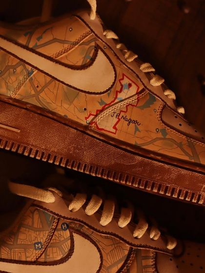 A close-up on the personalized detail of the Google Maps sneakers. The coffee-dyed background makes the highlighted "J.P. Nagar" area pop, showing how I can customize the design to your special places.