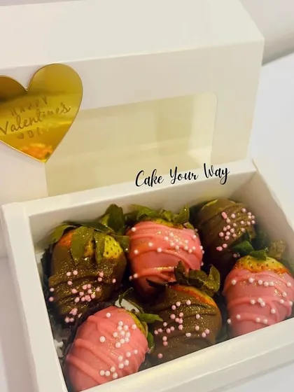 A classic romantic gift: chocolate-covered strawberries. I prepare these fresh for Valentine's Day, using milk and strawberry chocolate with delicate sprinkles.