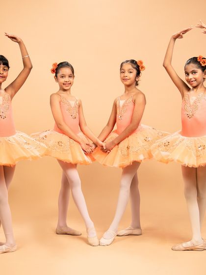 Dressed as blooming flowers, these dancers are ready for 'The Waltz of the Flowers' from The Nutcracker. Their poses capture the delicate beauty of nature's cycle, from bud to full bloom.