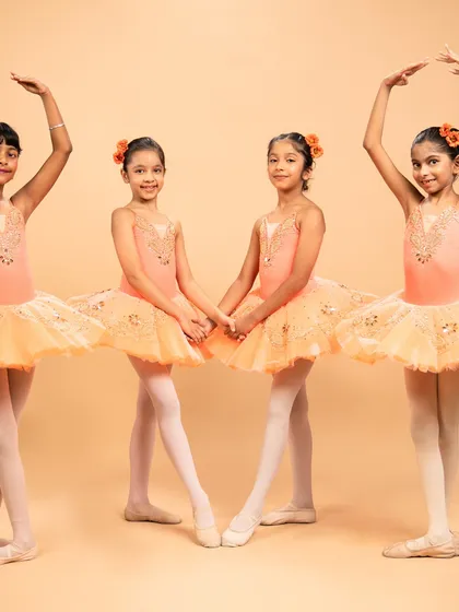 Dressed as blooming flowers, these dancers are ready for 'The Waltz of the Flowers' from The Nutcracker. Their poses capture the delicate beauty of nature's cycle, from bud to full bloom.