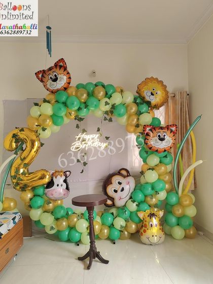 A 'Two Wild' jungle theme decoration perfect for a smaller space or home party, featuring a circular balloon arch with cute animal foil balloons.