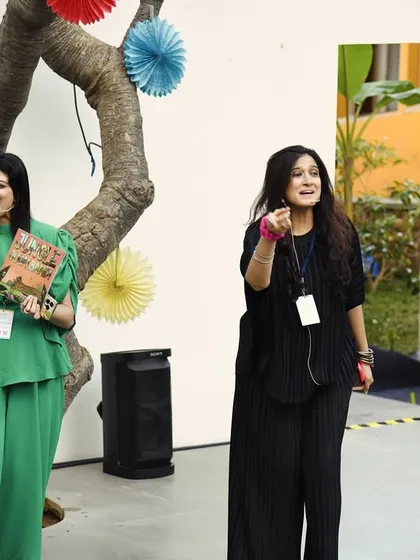A dynamic shot of us on stage in Hyderabad, leading the 'Jungle Jugalbandi' workshop with enthusiasm and energy.