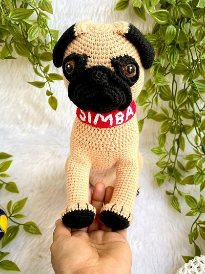 A full view of the "Simba" the pug replica doll. I used special techniques to shape his face and get his sweet, wrinkly expression just right. The collar is even personalized with his name.