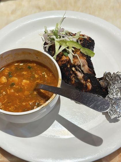 A restaurant meal of grilled chicken and soup. My plans teach you how to make healthy choices even when eating out.
