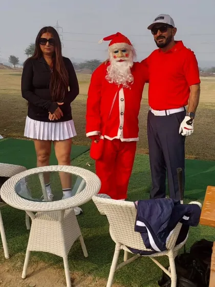 A couple poses with Santa on the range. Our festive events are designed to bring joy and a sense of community to our facility.