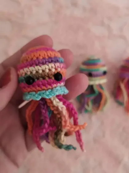 Look at the swirl of colors on this tiny jellyfish! I make these little charms using variegated yarn, so each one is unique. They are perfect for adding a pop of color to your bag or keys.