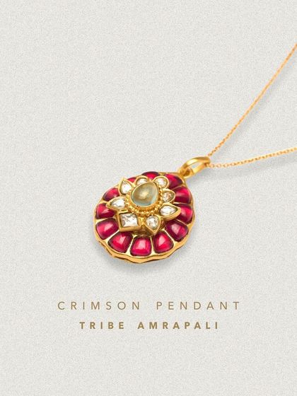 The Crimson Pendant is a miniature version of the Carnival of Crimsons Necklace. This elegant pendant captures the essence of the original with its vibrant red stones and intricate design.