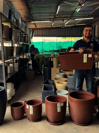 A view of the diverse range of roto pots I carry, including the popular brown 'kishti' planter and other round pots in various sizes.