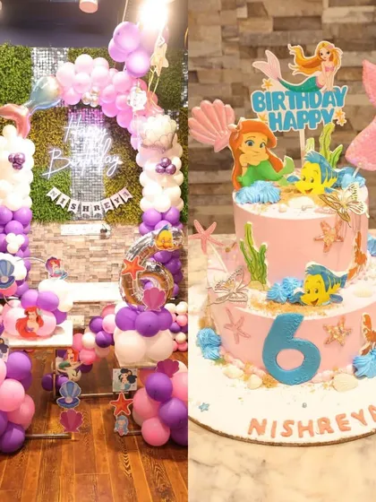 An 'Under the Sea' dream with this Little Mermaid theme, showcasing a stunning two-tier cake and a matching balloon arch.