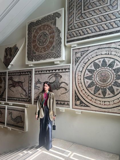 Standing in front of ancient mosaics, my modern outfit creates a fun contrast. This is what I love about style, it's a conversation with your surroundings.