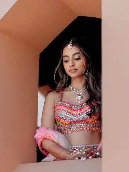 Meet our bride, Roshni, the girl with a smile that feels like sunshine and pure main character energy.